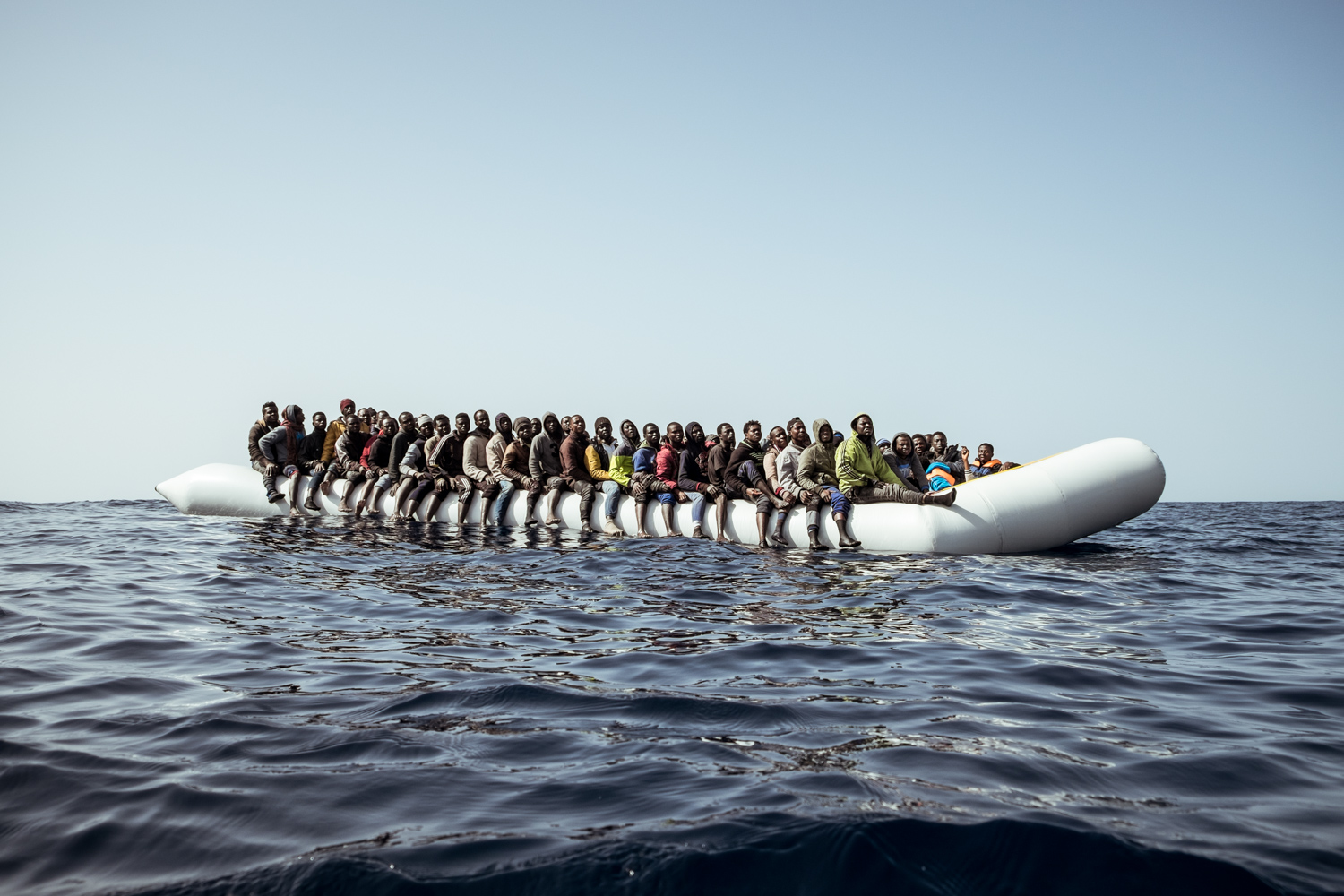 February 22nd 2017, 1PM. A rubber boat in distress overloaded with migrants photographed a few miles off the coast of Libya.